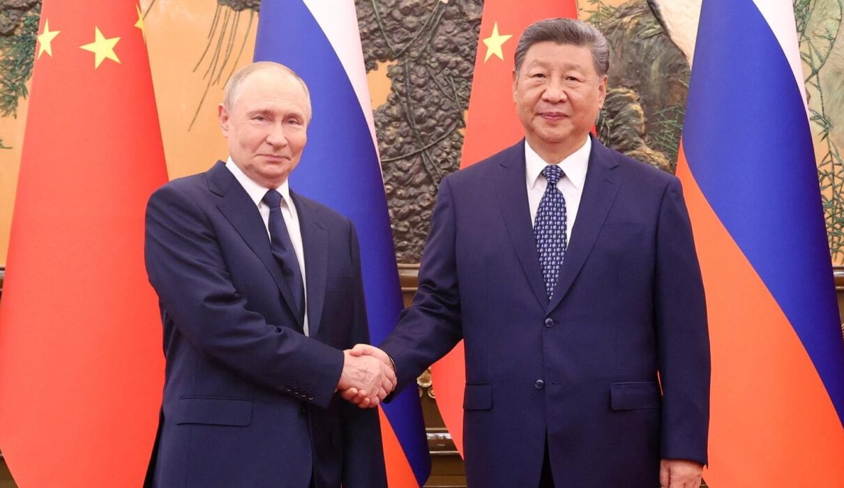 image showing handshake between putin and xi