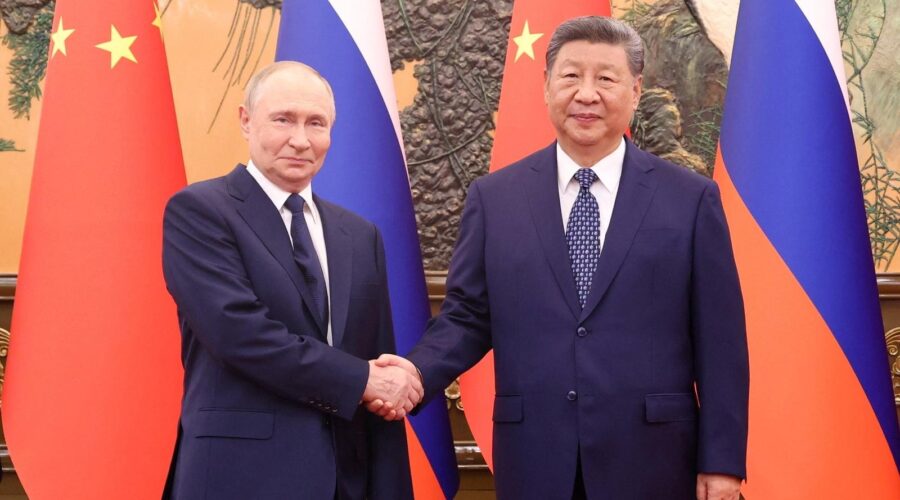 image showing handshake between putin and xi